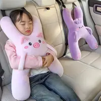 Plush pig neck pillow, ergonomic head support for car use, prevents forward head tilting during travel, soft and comfortable, includes seatbelt design, universal travel accessory.