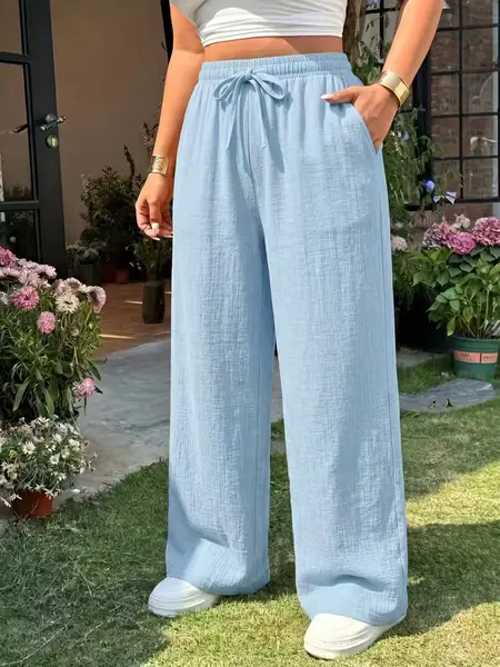 Women’s long pants with a drapey feel—ideal for home, casual outings, and leisure activities. They feature side pockets, a drawstring elastic waistband, and are a summer essential: comfortable, cool, and super versatile.