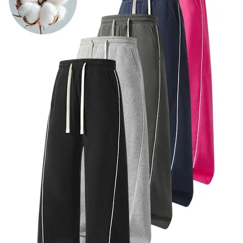 Jogger sweatpants with contrasting side stripes, high elasticity, elastic drawstring waist, loose fit that flatters the figure, suitable for both men and women, long pants for everyday sports.