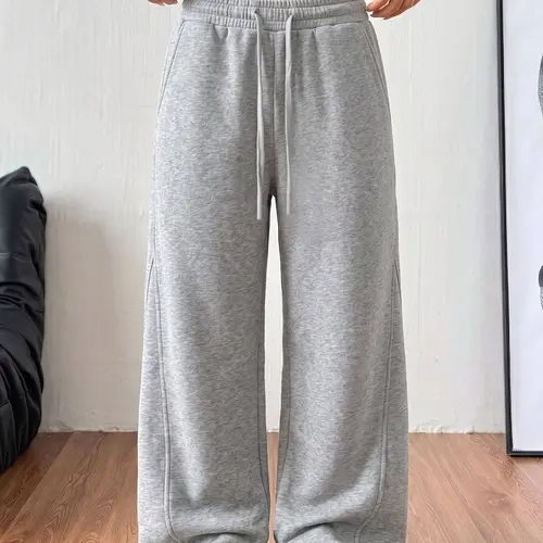 Women’s cotton wide-leg sweatpants with an elastic drawstring waist and side pockets, long length.Loose straight-leg casual pants, lightweight and breathable, suitable for home wear, commuting to work, and everyday wear.