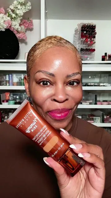 This Skin Tint is not just another foundation, it's a game-changer for mature skin! It will give you the perfect balance of moisture, coverage, and glow. It's lightweight and lets the skin breathe while masking imperfections and enhancing my natural beauty.  If you need a little more coverage, try the Yummy Skin Blurring Balm. This is a balm-to-powder formula. The perfect long lasting, shine free look. @DanessaMyricksBeauty #danessamyricks #yummyskintint #skintint #over50makeup #over50makeuptips 