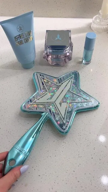 Stay moisturized this season with our #iconic Wyoming Winter Collection ❄️💦 Pair these cold weather must haves with our NEW winter inspired Snow Globe Hand Mirror 🌨️✨️⁠ ⁠ Our winter routine ⤵️⁠ NEW Snow Globe Hand Mirror⁠ Wyoming Winter Hand Cream⁠ Wyoming Winter Restorative Crème Moisturizer ⁠ Wyoming Winter Lip Oil⁠ ⁠ 🎥 @marina.ledean⁠ ⁠ #jeffreestar #jeffreestarskincare #winterskincare #winteressentials #wyomingwinter #skincare