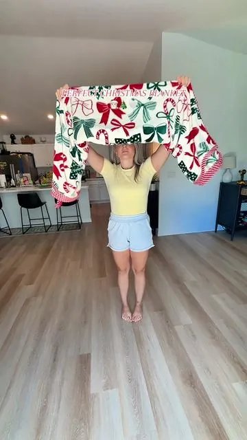 I found the perfect Christmas blanket of the season! 🤌🏼🤍🎄#christmasinjuly #holidayblanket #bowblanket #cozychristmas #tiktokshopfinds #christmasdecor #giftideas #holidayvibes 