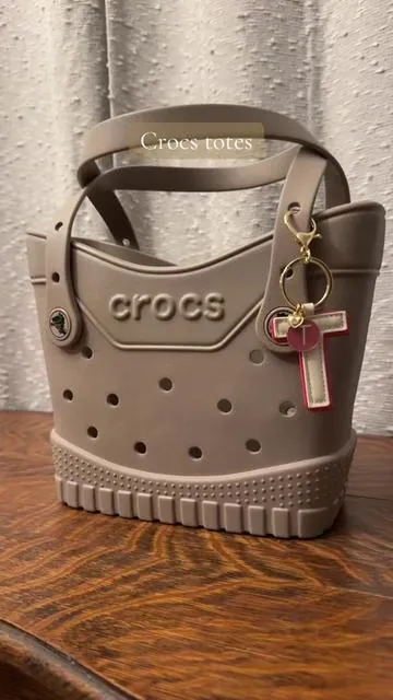 Classic crocs tote bag in taupe. Small in size but holds all the essentials. Great work bag. #crocstote 