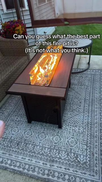 Rectangular propane fire pit with a cool-touch ceramic edge—yes, really. ⬇️ What do YOU think of this design? #firepit #firepits #backyardvibes #patiodecor #patioseason 