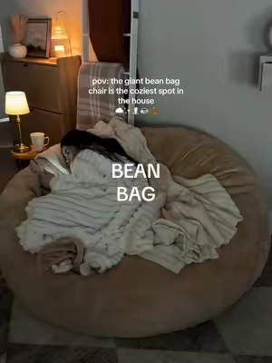 the coziest spot in our house! My entire family loves this bean bag chair especially my kids! The memory foam filling makes it so soft and comfy! The fabric cover is so soft and easy to throw in the wash! It's going to be so nice to have for the holiday months ☁️☕️🕯️ #beanbag #beanbagchair #loungechair #cozyhome #cozychair 