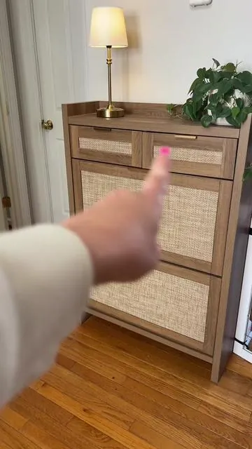 This #shoecabinet is a game changer. Holds about 16 pairs of shoes with additional storage underneath. The divider shelf is also adjust for taller shoes or boots. #shoes #shoestorage #storage #storagehacks 
