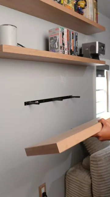 I didn’t even know floating shelves were this easy to install! 😳 #floatingshelves #decor #livingroomdecor #tiktokshopcreatorpicks 