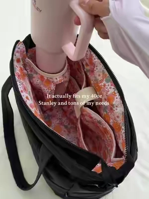 Super cute, very spacious inside, fits my 40oz Stanley, and very durable I would definitely purchase again 😊 #whatsinmybag #totebag #StanleyCup #workbag #collegebag 