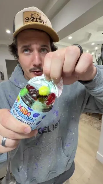 Dip it in the sour powder for an extra sour kick #candy #gummies #candeeze 
