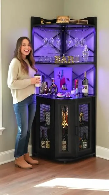 Elevate your home setup with the Homieasy LED Corner Bar Cabinet! ✨ This sleek industrial wine cabinet is perfect for organizing your favorite bottles and glassware. Featuring a convenient power outlet, built-in LED strip, and glass holders, it adds both style and functionality to any room. Its 5-tier design makes it ideal for small spaces, serving as a display cabinet or a full liquor bar unit. Tap to shop and create your ultimate home entertainment zone! #HomeBar #CornerCabinet #DealsForYouDays #AIGC #Moras