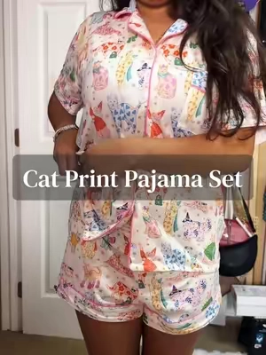 Cat lovers, we have officially found our lounging uniform. 😂🐱 This Women’s 2-Piece Cat Family Sleepwear & Loungewear Set comes with a short-sleeve lapel top and matching wide-leg shorts covered in the cutest cat-family design. Perfect for sleeping, lounging around the house, or packing for a cozy vacation. Now all you need is your actual cat beside you. 😻🐾 #CatLovers #CatMom #CutePajamas #Loungewear #tiktokshopstockup 