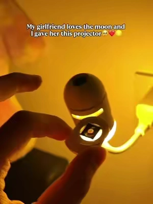 She loves looking at the moon😊 #galaxy #ambientlighting #giftideas #night #starprojector 