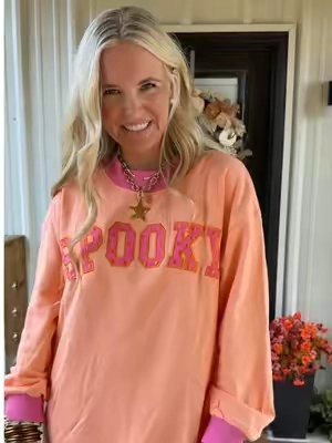 This mockneck sweatshirt is perfect for fall and Halloween! Love the embroidered/appliquéd polka dot letters too! #tiktokshopcreatorpicks #tiktokshopstockup #falloutfitinspo #mocknecksweatshirt #halloweensweatshirt 