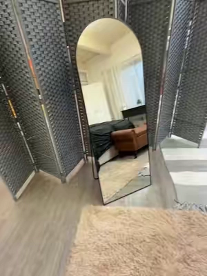 This full-length arched mirror looks WAY more expensive than it is 😍 Freestanding easel design makes it rental-friendly, or use the included mounts to hang it on the wall. Multiple trim colors + a seriously affordable price for a mirror this size! #FullLengthMirror #ArchedMirror #AffordableHomeDecor #RentalFriendlyDecor #BedroomDecor 