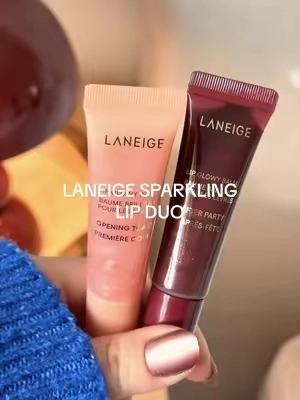 Two full-size Lip Glowy Balms in Opening Toast—a sheer burgundy shimmer—and After Party—a sheer champagne shimmer ✨ the cutest holiday duo for glossy, moisturized lips #laneige #lipglowybalm #lipbalm #holidaybeauty #tiktokshopfinds