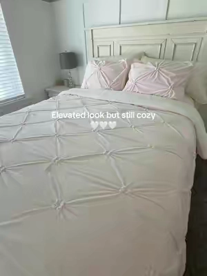 Classy on the outside, ridiculously cozy underneath. 🤍 This pin-tuck comforter set has an elevated look with that soft Sherpa feel that makes your bed so inviting. #PinTuckComforter #bedding #sherpa #ComforterSet #CozyBedroom 
