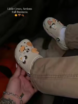His little Crocs got the fall treatment! These are the color FRAPPE 🤎 CHARMS SOLD SEPARATELY #CROCS #toddlercrocs #kidscrocs #fallvibes #crocsclogs 