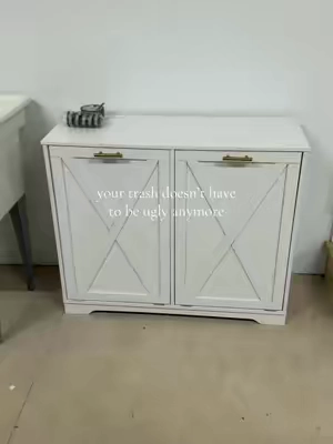This white tilt-out trash cabinet with double compartments is such a cute way to hide your garbage and recycling while adding extra kitchen storage and keeping everything looking clean and organized 🤍🗑️ Bins not included. #kitchenorganization #trashcabinet #kitchenstorage #homeorganization #tiktokshopstockup 