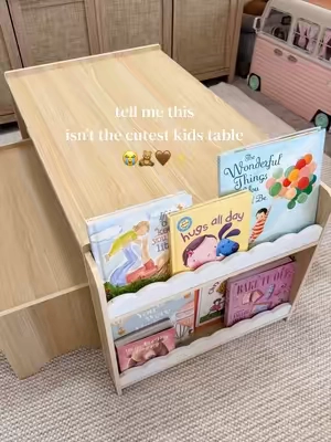 A table, seating AND built-in storage for books and toys 🙌 Such a smart setup for playrooms, bedrooms or homeschool spaces. #kidsfurniture #playroomideas #montessori #toyorganization #momfinds 