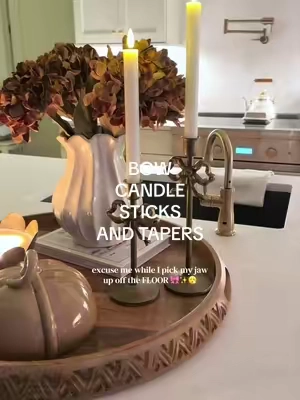 The cutest little bow candle holders with flameless tapers 🎀✨ such an easy way to make your holiday table, centerpiece, mantel, or holiday decor feel extra special without doing too much. #holidaydecor #flamelesscandles #holidayhomedecor #candlesticks #homedecor  @QVC, Inc 