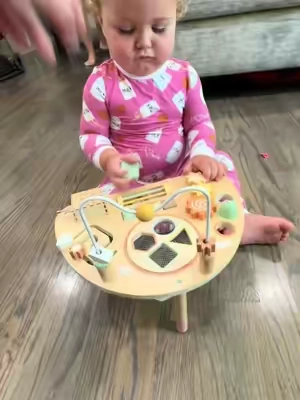 We have used this Montessori activity table since she was 6 months old. Definitely worth it. She still enjoys it! #montessoritoys #toddlertoys #woodentoys #toddlerlearning #toddleractivities 