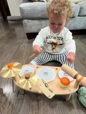 We love our wooden drum set! We’ve had this since she was around 7-8 months old and we still use it at 21 months! #toddlertoys #babytoys #kidsdrumset #woodentoys #finemotorskills 