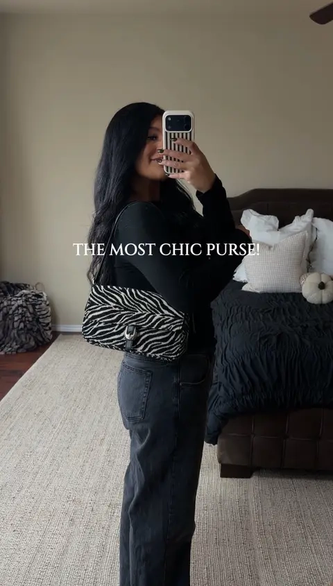 How chic is this zebra print purse?! I love how it elevated all my basic outfits and gives them a little spice! So obsessed with the black and white but there’s other shades in the zebra that are too cute!  Chic Fall Purse. Zebra Print Purse. Shoulder Bag. #zebra #zebraprint #purse #shoulderbag #chicbags 