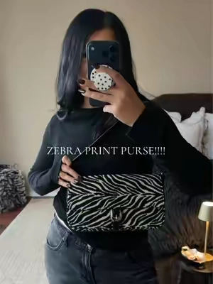 I COULDNT BE MORE OBSESSED WITH ZEBRA PRINT! Animal print is so chic to me so I had to grab this chic little shoulder Bag! So adorable!!  Chic Fall Purse. Zebra Print Bag. Shoulder Bags. #zebra #zebraprint #shoulderbag #purse #chicbags 
