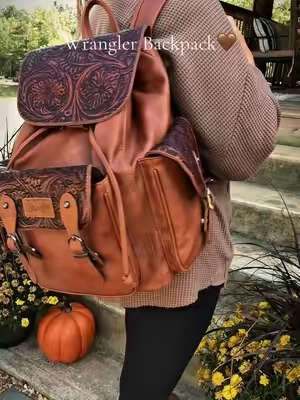 This backpack was made for fall. The western tooled designs, the saddle pockets, obsessed ✨ @Rustic Charm Bootic #wrangler #westernstyle #backpacks #wranglerbag #fallaesthetic 
